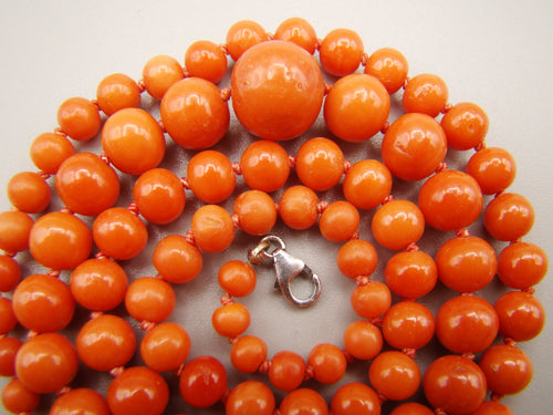 Close-up of the largest central coral bead, smaller graduated beads and the 925 silver clasp