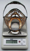 Close-up of stamped marks on the inside of the silver basket handle.