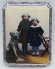 900 silver cigarette case with a colourful scene of two children and a dog, framed by a blue-and-white border.