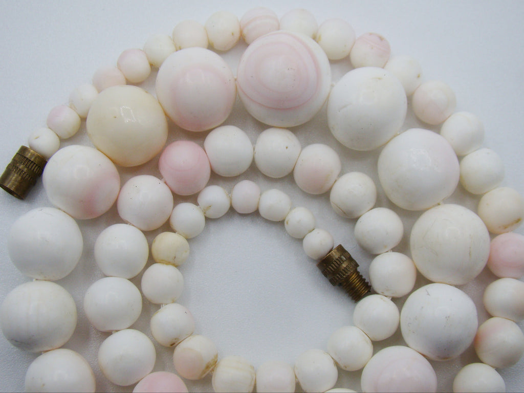 Alternate overall view of the graduated coral necklace with its barrel screw clasp open