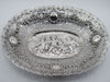 Overall view of an oval Baroque-style 800 silver tray with cherub relief and pierced floral borders