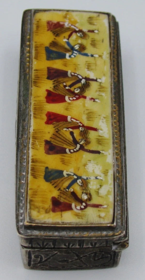 Angled end view of the miniature silver box and enamel-on-bone figural panel