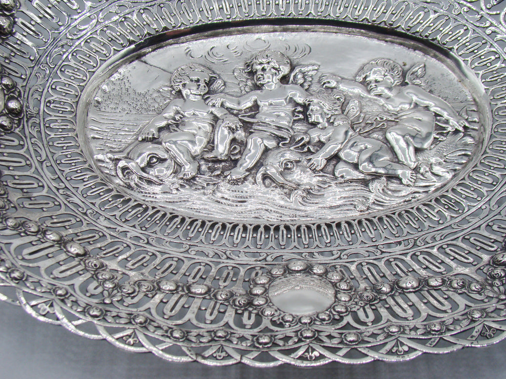 Lower border and central relief detail of the ornate oval silver tray