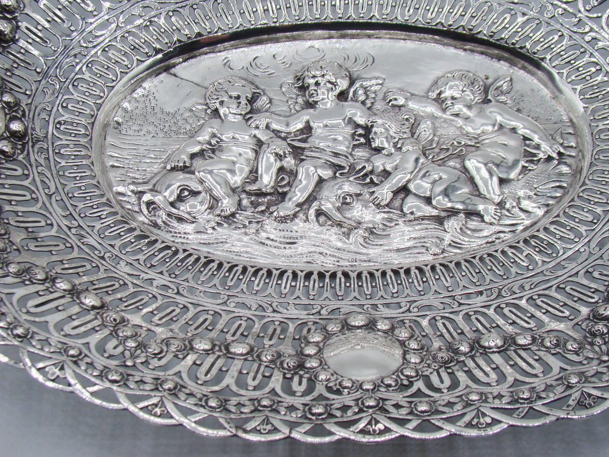 Lower border and central relief detail of the ornate oval silver tray