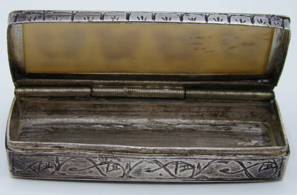 Open silver box showing the interior, hinge and reverse of the bone lid panel