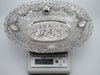 Oval silver tray on a digital scale displaying 391 grams