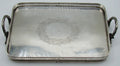 Ottoman-attributed rectangular silver tray with two ornate handles and engraved central floral wreath