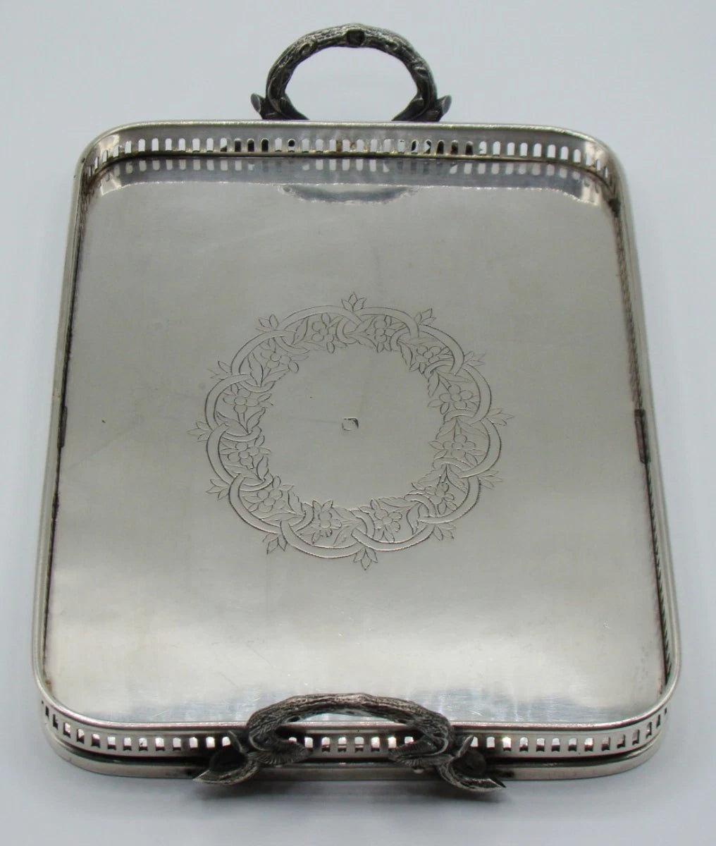 Full view of the silver tray showing the pierced gallery and floral engraving