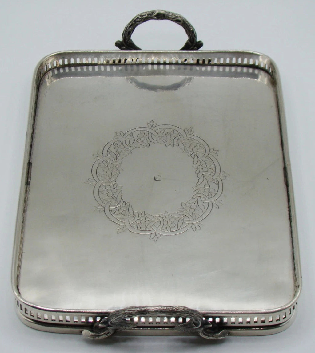 Alternate lengthwise view of the engraved silver tray and pierced rim