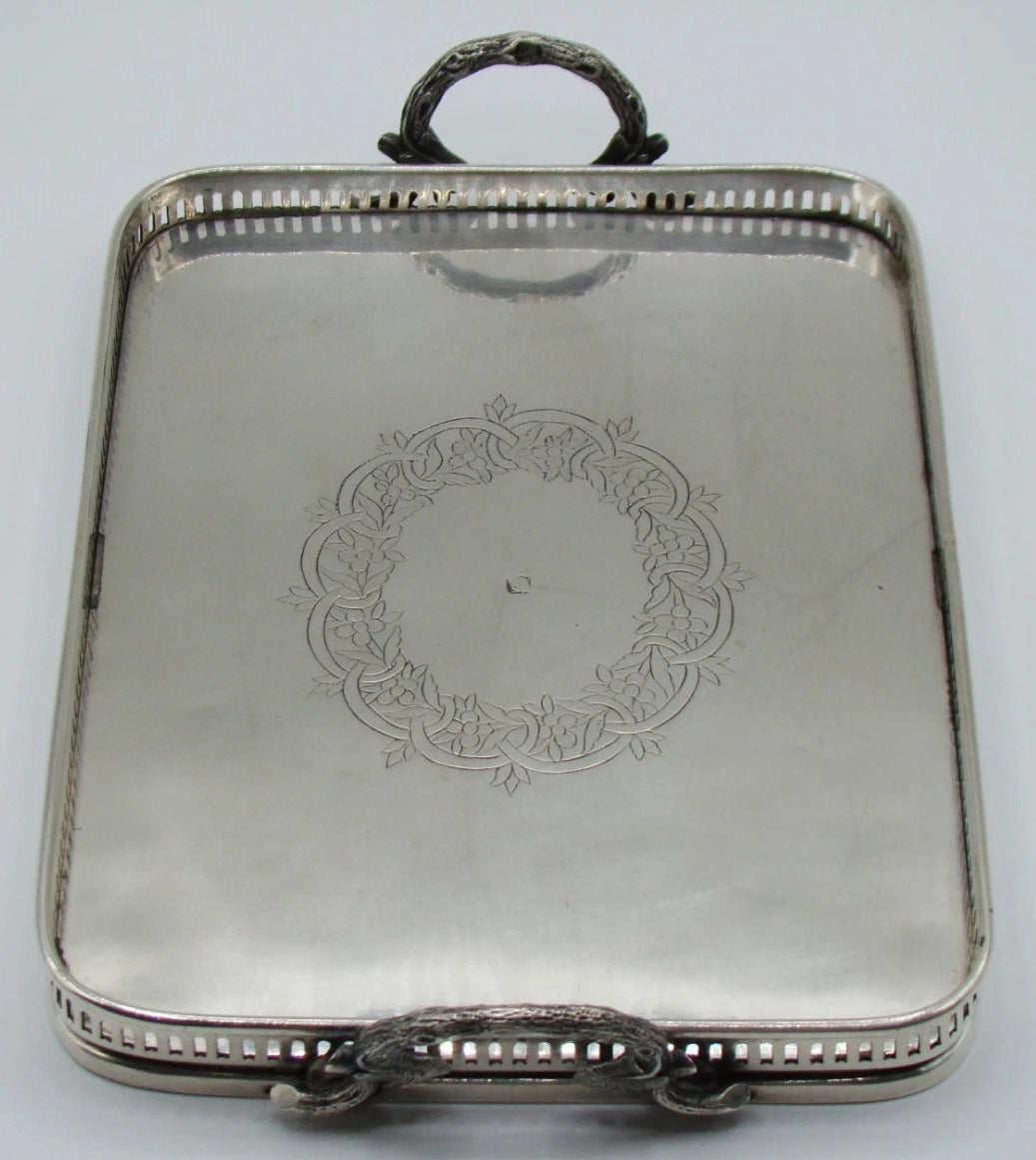 Alternate lengthwise view of the engraved silver tray and pierced rim