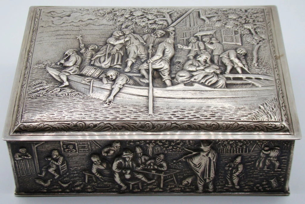900 silver rectangular box showing the boating relief on its lid and tavern scene on the front.