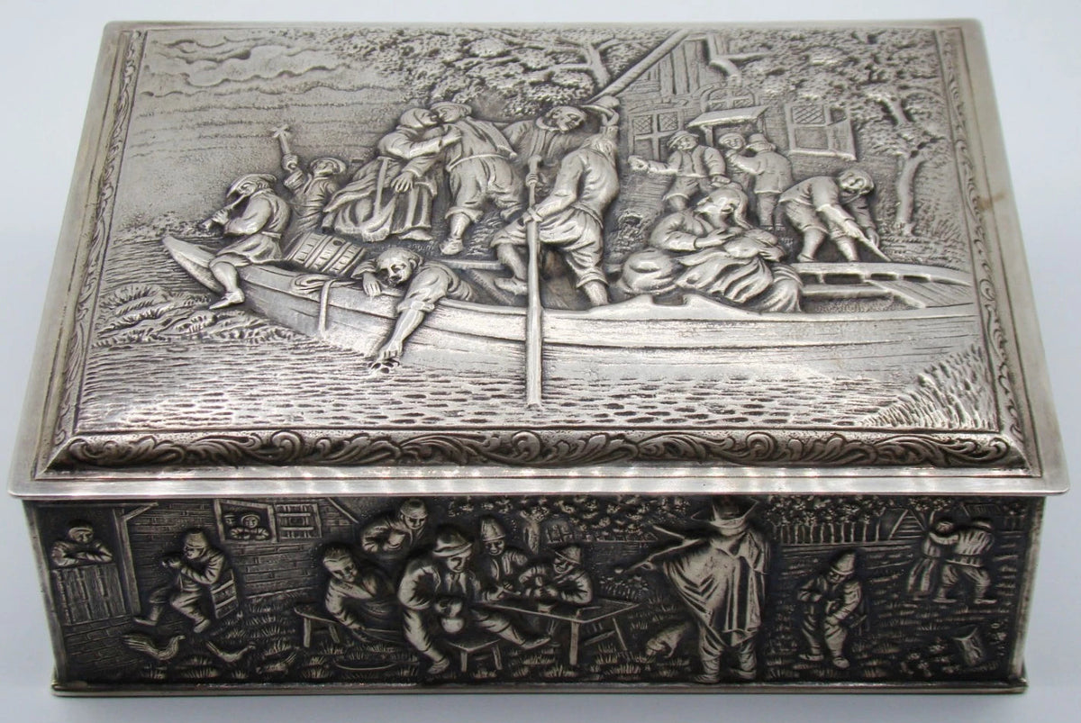 900 silver rectangular box showing the boating relief on its lid and tavern scene on the front.