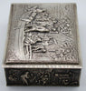 Side view of the silver box showing figures gathered around barrels and a table in relief.