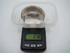 Silver cuff bracelet on a digital scale displaying 21.8 grams.