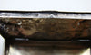 Silver relief box on a digital scale displaying 77 grams.