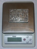 Close-up of stamped marks on the interior rim of the silver box.