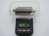 Six antique silver filigree mouthpieces in a tray on a digital scale displaying 46.7 grams