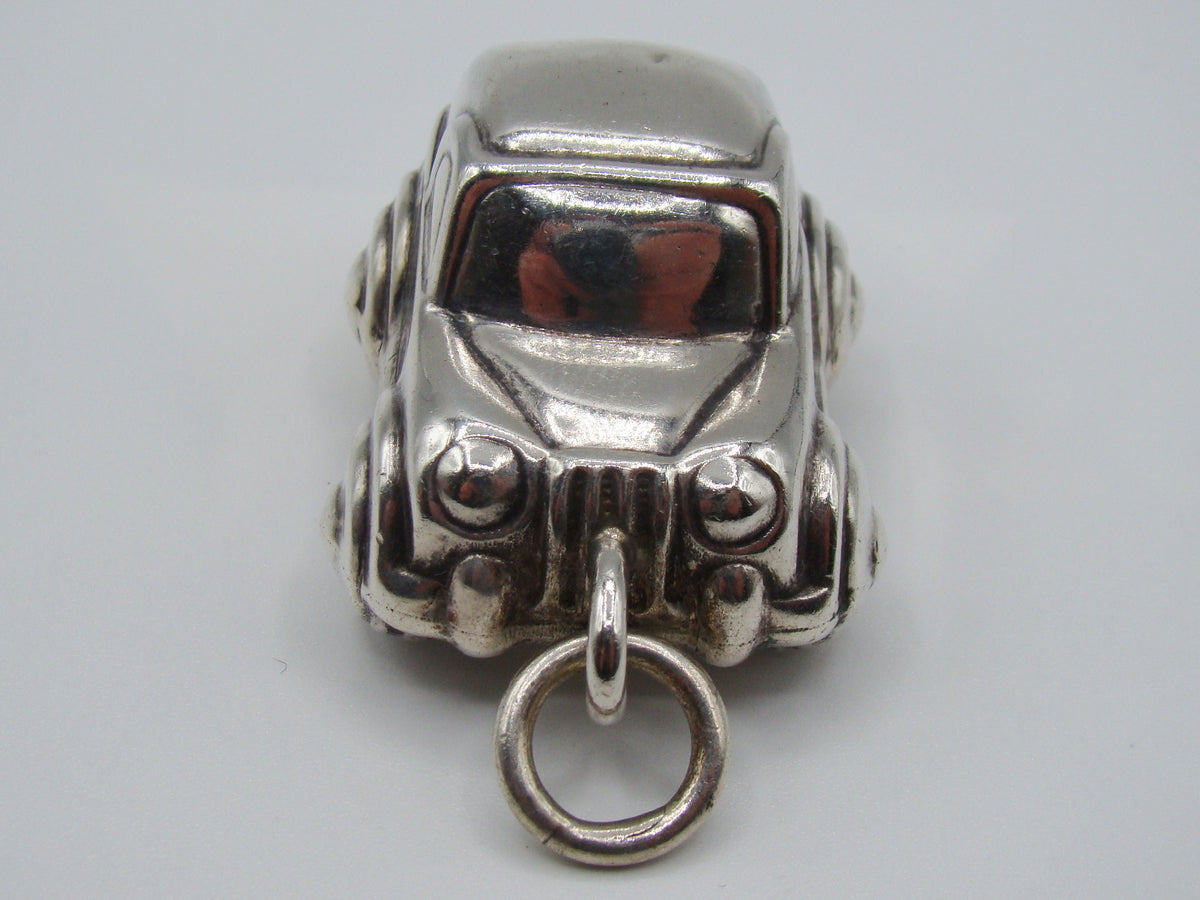Rear view of silver miniature car with modelled bumper