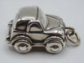 Side view of 925 sterling silver miniature car pendant with suspension ring