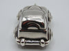 Elevated front view of sterling silver miniature car and suspension ring