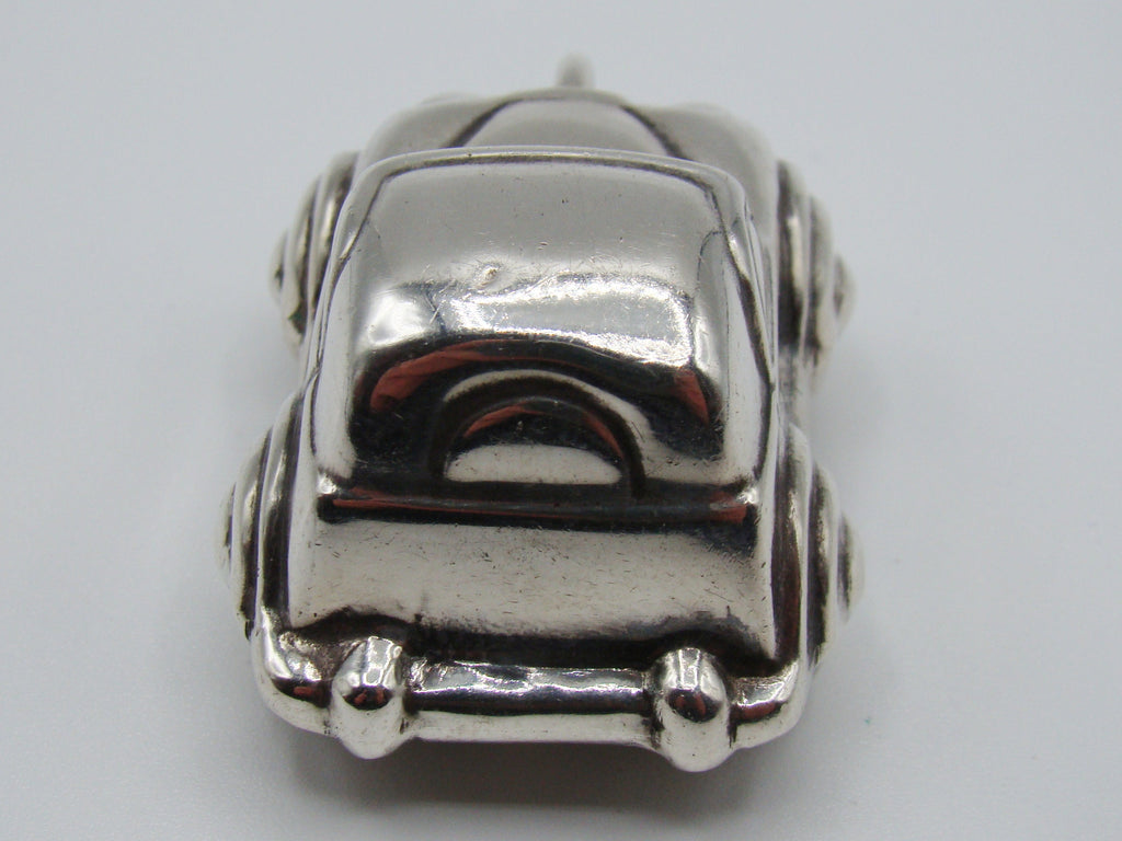 Elevated front view of sterling silver miniature car and suspension ring