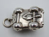 Underside of silver miniature car showing 925 stamp and additional mark