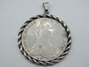 Maria Theresa silver coin pendant with twisted rope-style frame and suspension bail