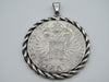 Reverse of Maria Theresa coin pendant showing double-headed eagle and date 1780