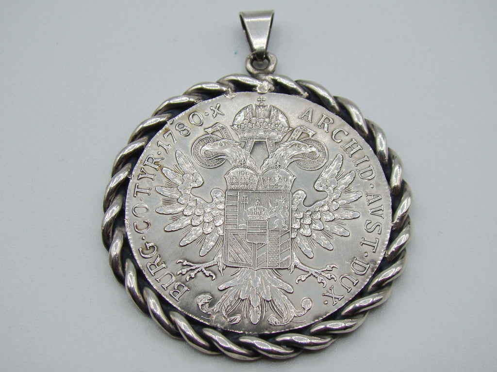 Reverse of Maria Theresa coin pendant showing double-headed eagle and date 1780