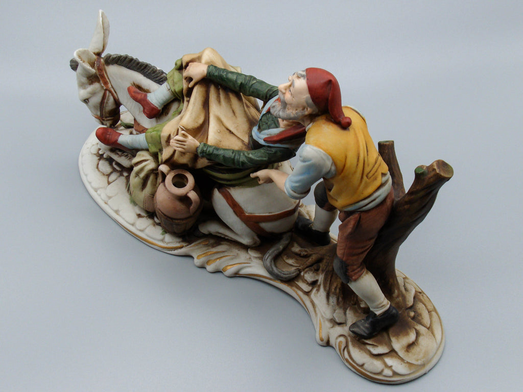 Merchant pair with donkey porcelain figurine