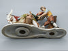 Merchant pair with donkey porcelain figurine
