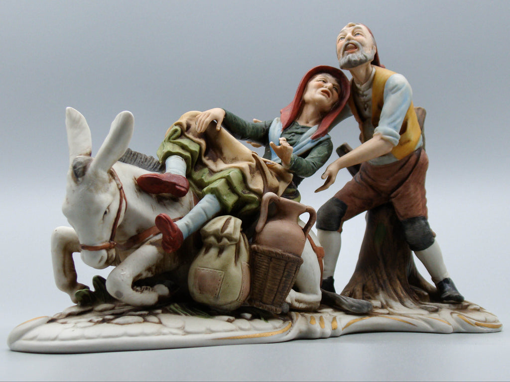 Merchant pair with donkey porcelain figurine